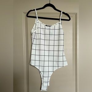 Adara Black and White body suit.